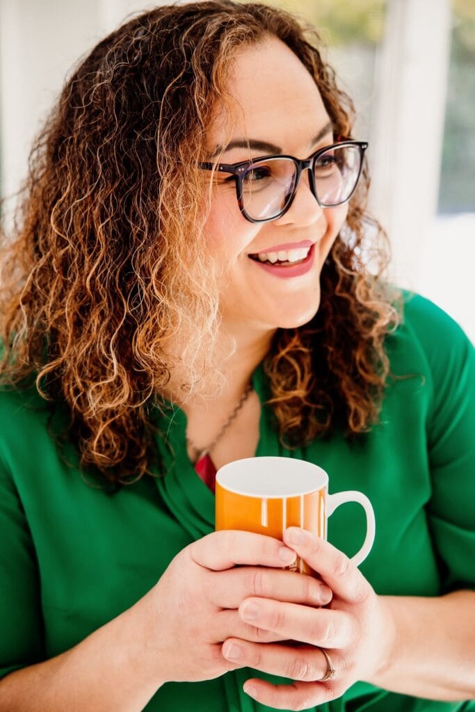 Kelly Bejelly drinking a hot cup of tea